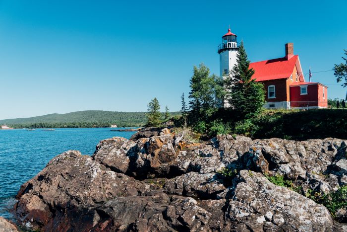 Eagle Harbor Lighthouse on the rocky shore of Lake Superior. .